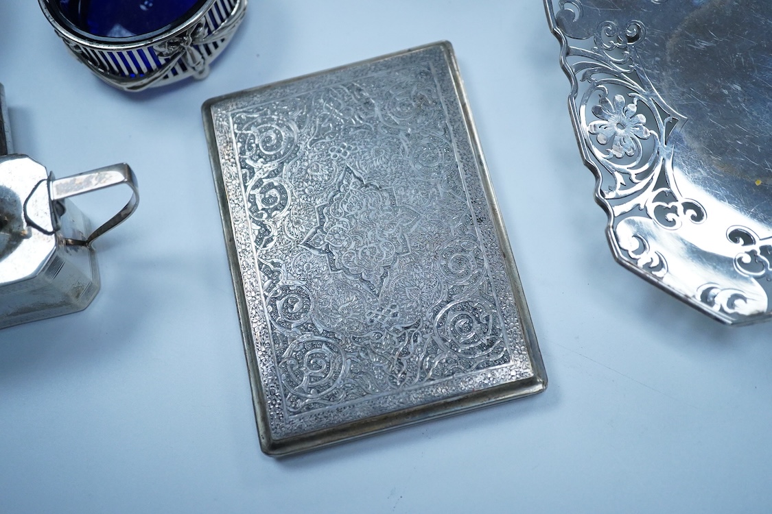 A small group of silver to include an Elizabeth II pierced shallow dish by Viners Ltd, Sheffield, 1957, diameter 12.4cm, a 1930's silver mounted cigarette box, a George III silver fiddle pattern sauce ladle and five silv